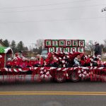 Moms and babies, toddlers and dancers on Christmas parade float